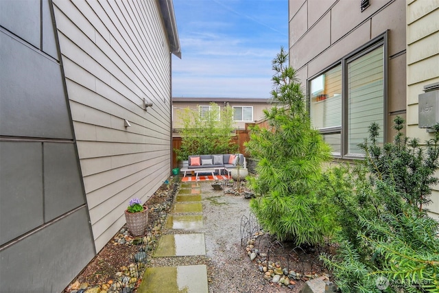 view of yard with a patio area, fence, and an outdoor living space