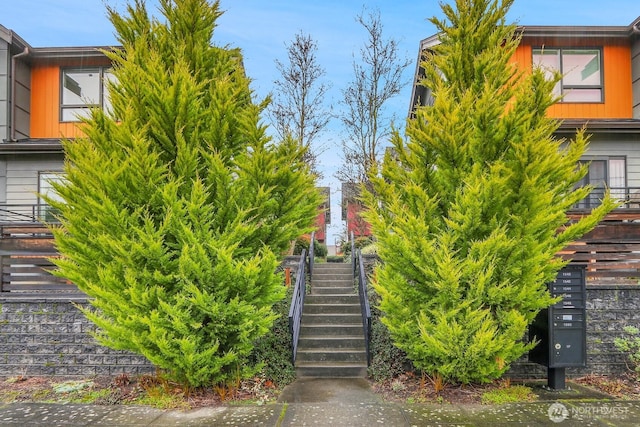 exterior space featuring mail area and stairway