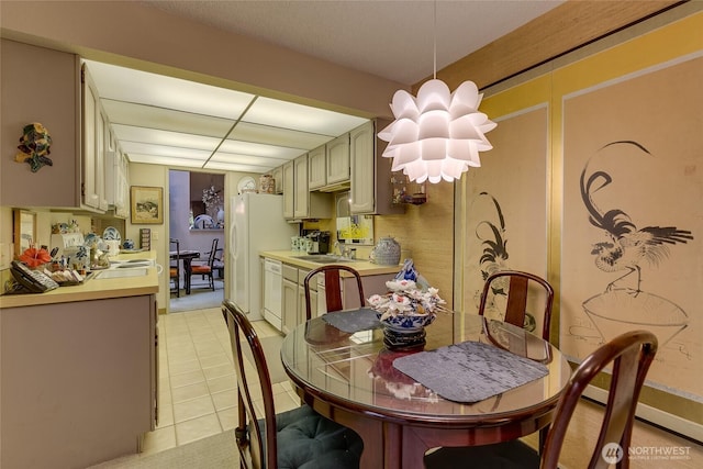 dining space featuring light tile patterned flooring