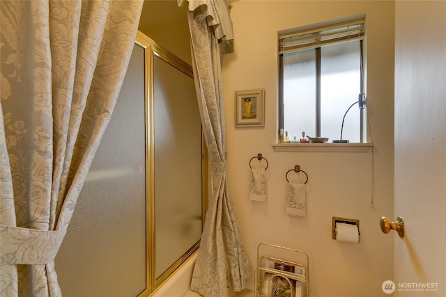 bathroom featuring enclosed tub / shower combo