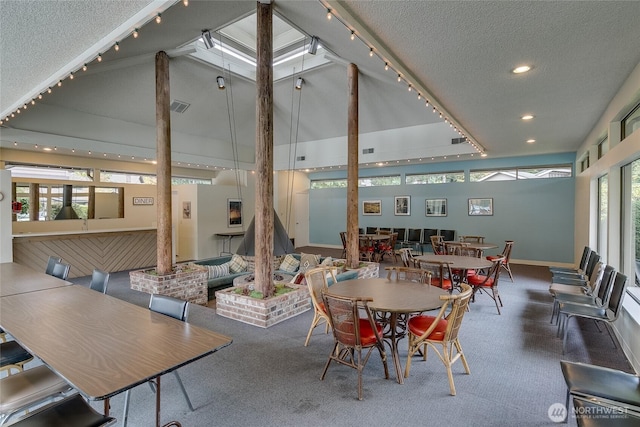 dining space with recessed lighting, visible vents, a textured ceiling, and rail lighting