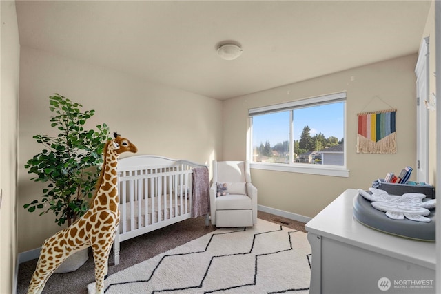 bedroom with a nursery area, light colored carpet, visible vents, and baseboards