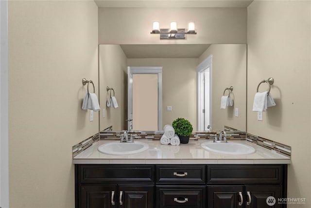 bathroom featuring double vanity and a sink