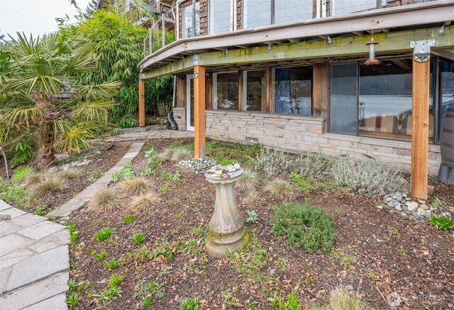 view of property exterior with stone siding