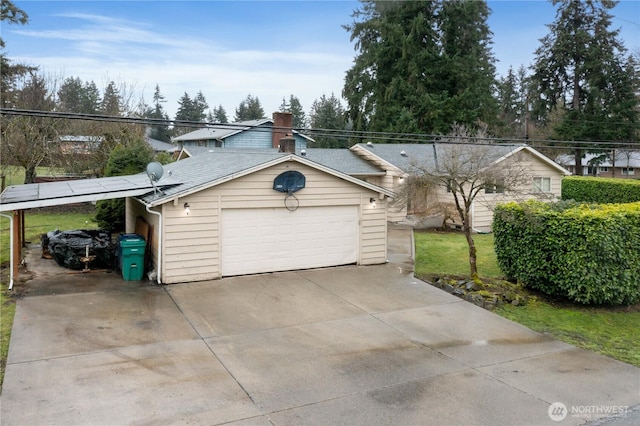 view of front of home featuring driveway and a chimney