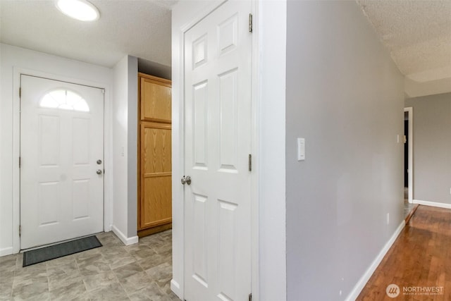 17123 6th Avenue Ct E, Spanaway, WA 98387 - foyer with a textured ceiling and baseboards