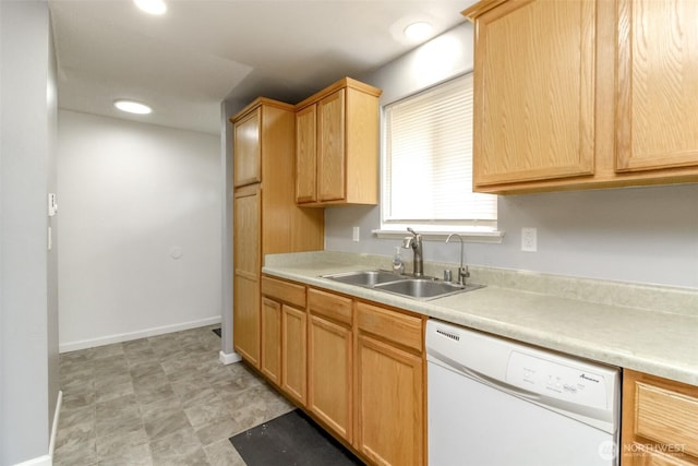 17123 6th Avenue Ct E, Spanaway, WA 98387 - kitchen featuring dishwasher, a sink, light countertops, light brown cabinetry, and baseboards