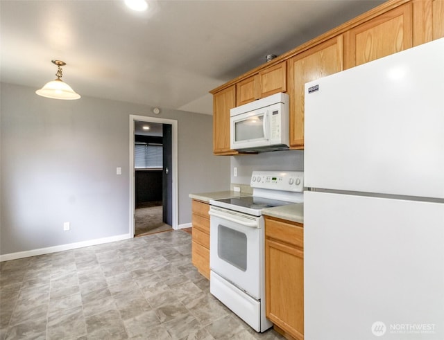 17123 6th Avenue Ct E, Spanaway, WA 98387 - kitchen with white appliances, baseboards, light countertops, and hanging light fixtures