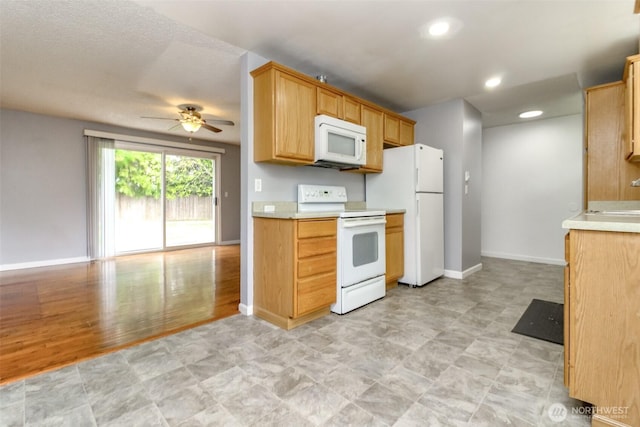 17123 6th Avenue Ct E, Spanaway, WA 98387 - kitchen with white appliances, ceiling fan, light countertops, baseboards, and recessed lighting