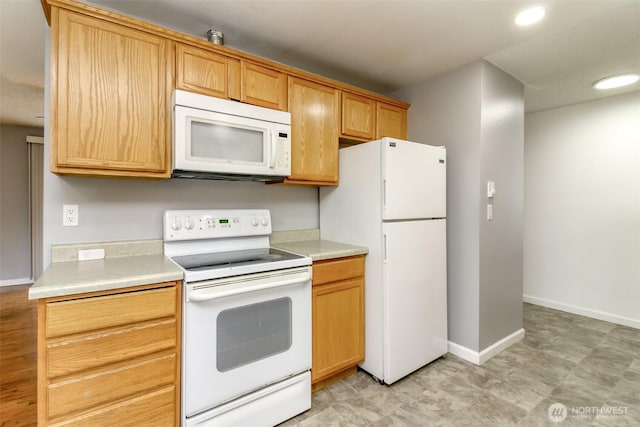 17123 6th Avenue Ct E, Spanaway, WA 98387 - kitchen featuring white appliances, light countertops, recessed lighting, and baseboards