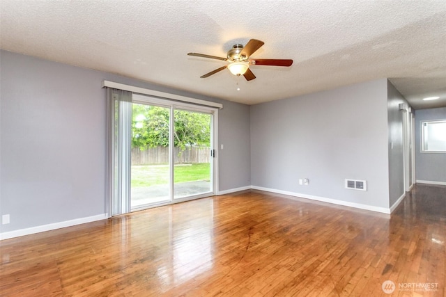 17123 6th Avenue Ct E, Spanaway, WA 98387 - empty room featuring ceiling fan, hardwood / wood-style floors, a textured ceiling, and baseboards