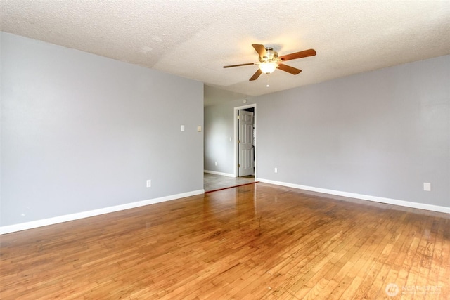 17123 6th Avenue Ct E, Spanaway, WA 98387 - spare room with ceiling fan, wood-type flooring, baseboards, and a textured ceiling