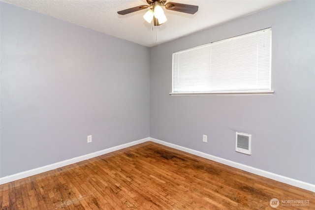 17123 6th Avenue Ct E, Spanaway, WA 98387 - spare room with ceiling fan, baseboards, and wood finished floors