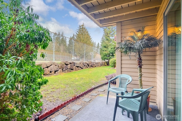 view of patio / terrace featuring fence