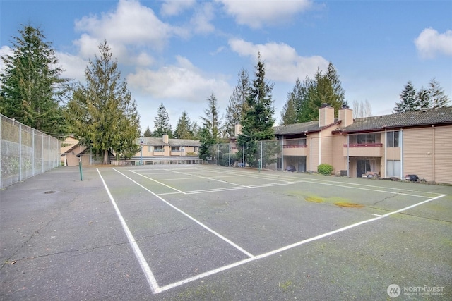 view of tennis court with fence