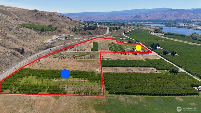 aerial view with a rural view and a water and mountain view