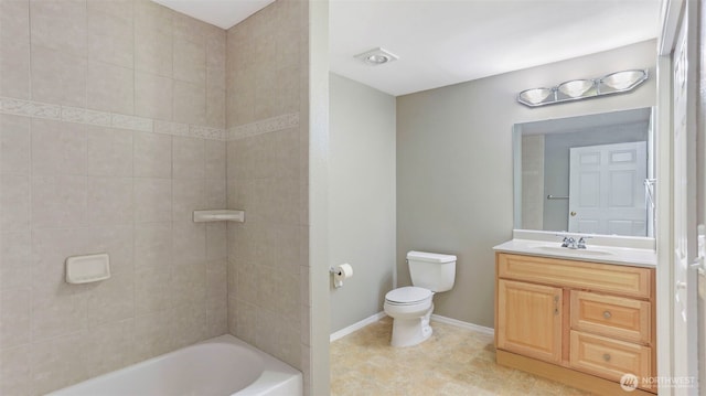 full bath featuring shower / bathing tub combination, vanity, toilet, and baseboards