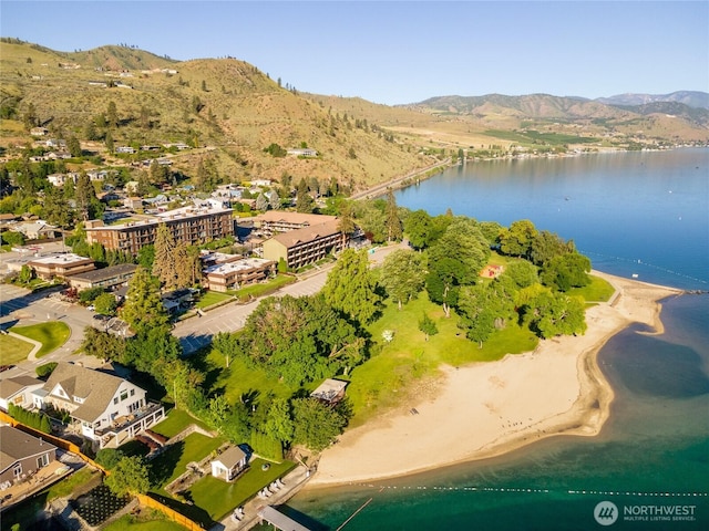 drone / aerial view with a water and mountain view