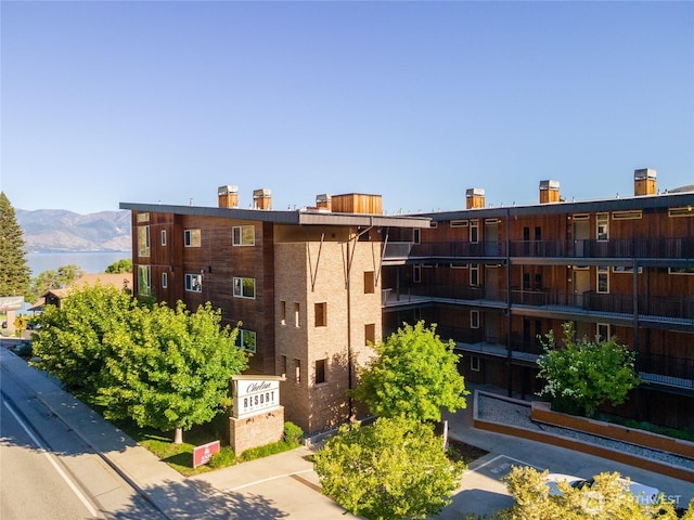 view of property featuring a water and mountain view