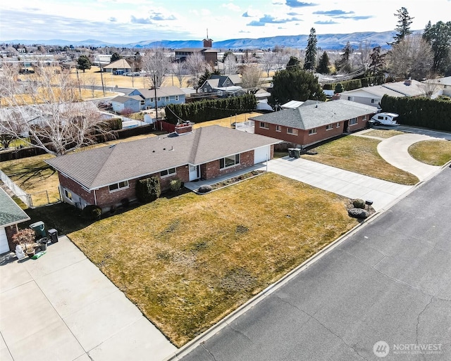 drone / aerial view with a residential view and a mountain view