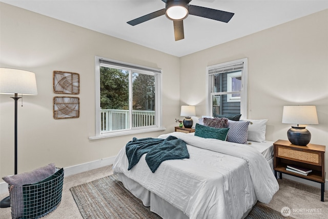 bedroom featuring carpet, baseboards, and a ceiling fan