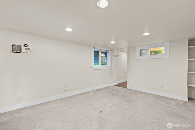 below grade area featuring baseboards, carpet flooring, and recessed lighting