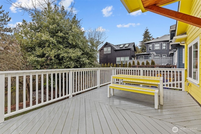 wooden deck featuring a residential view