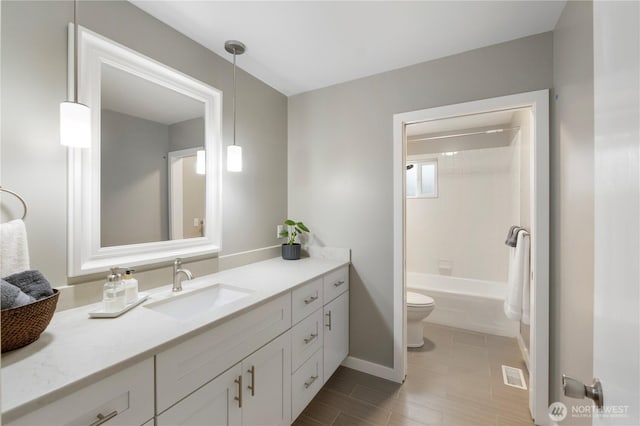 bathroom featuring visible vents, shower / bathtub combination, toilet, and vanity