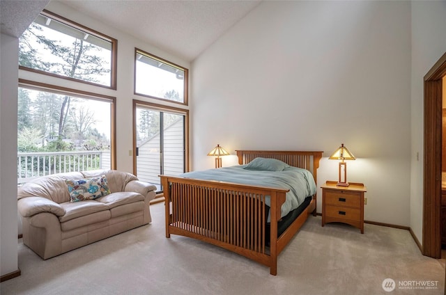 bedroom with carpet flooring, a textured ceiling, high vaulted ceiling, access to outside, and baseboards