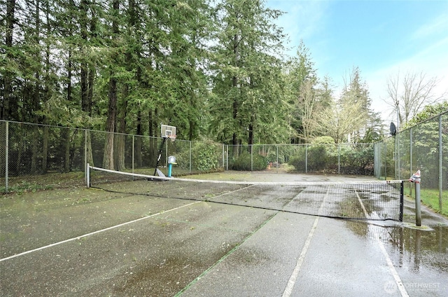 view of sport court with community basketball court and fence