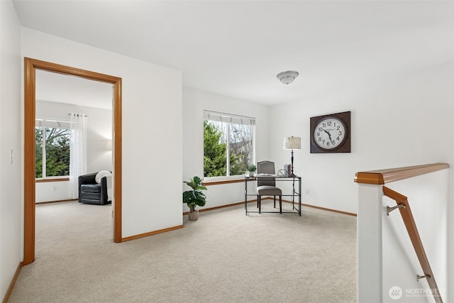 carpeted home office with baseboards