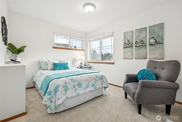 bedroom with carpet and baseboards