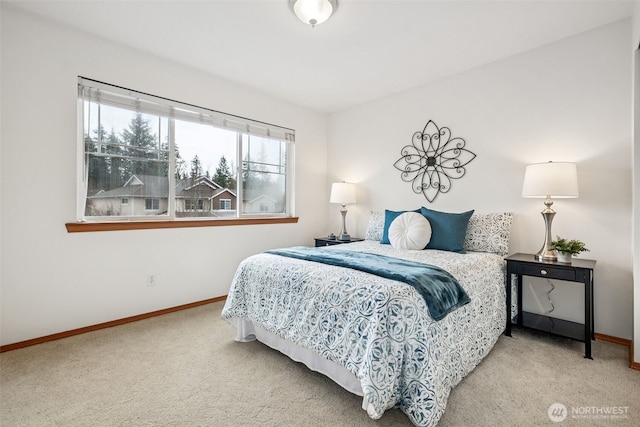 bedroom featuring carpet flooring and baseboards