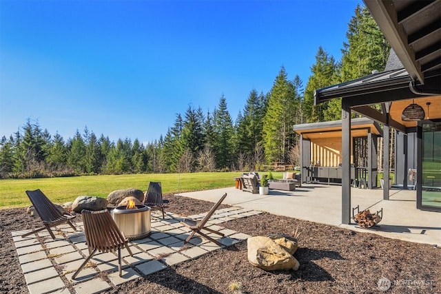 view of patio / terrace featuring an outdoor fire pit