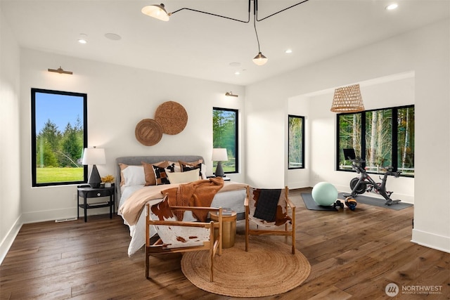 bedroom with recessed lighting, multiple windows, and hardwood / wood-style flooring