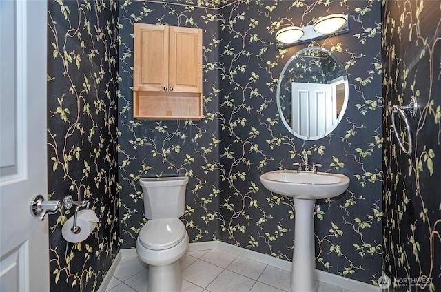 4329 Fairwood Blvd NE, Tacoma, WA 98422 - half bathroom featuring tile patterned flooring, toilet, and baseboards