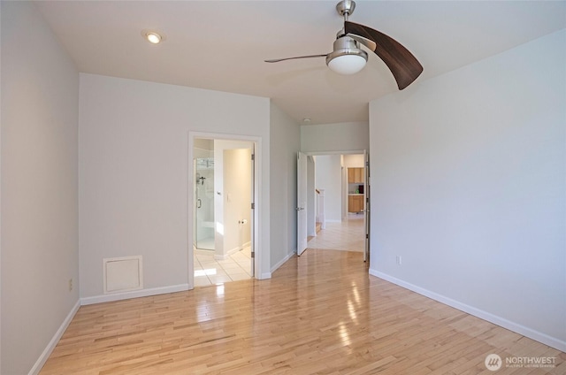 4329 Fairwood Blvd NE, Tacoma, WA 98422 - unfurnished bedroom with a ceiling fan, baseboards, light wood finished floors, and connected bathroom
