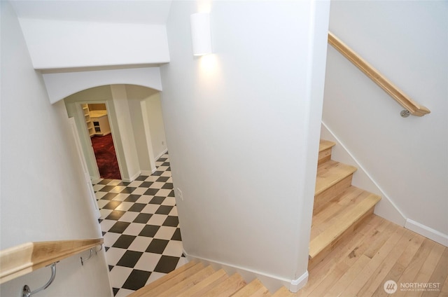 4329 Fairwood Blvd NE, Tacoma, WA 98422 - stairs featuring tile patterned floors, baseboards, and arched walkways