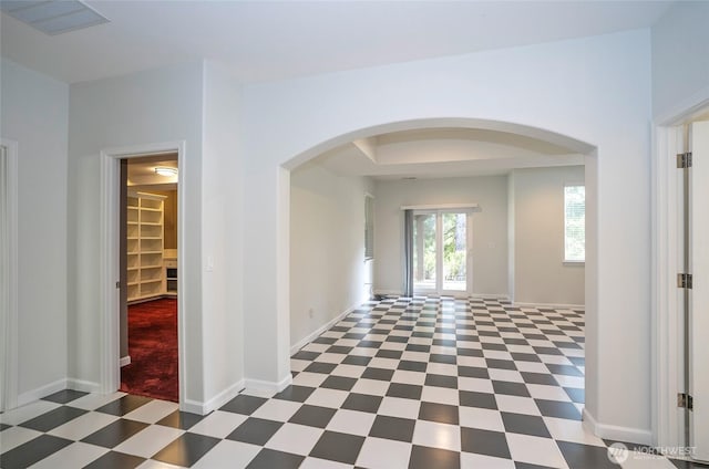 4329 Fairwood Blvd NE, Tacoma, WA 98422 - hall featuring tile patterned floors, visible vents, arched walkways, and baseboards