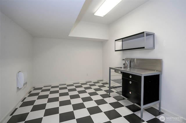4329 Fairwood Blvd NE, Tacoma, WA 98422 - interior space with baseboards, light floors, dark cabinets, and a sink