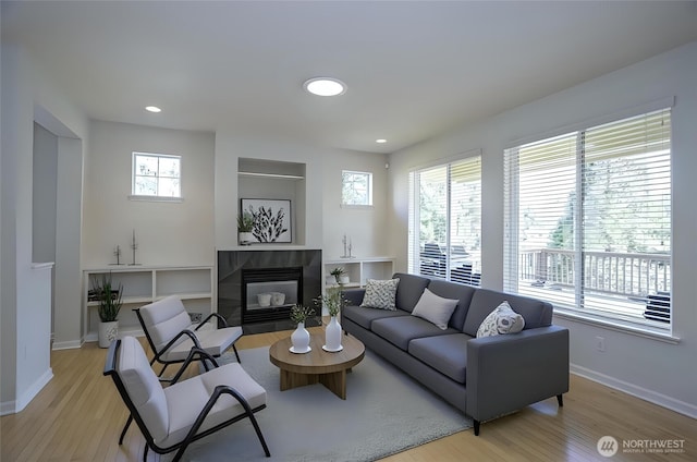4329 Fairwood Blvd NE, Tacoma, WA 98422 - living room with recessed lighting, light wood-type flooring, baseboards, and a fireplace