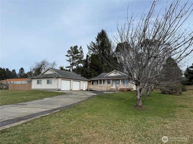 view of front of property with a front yard and fence