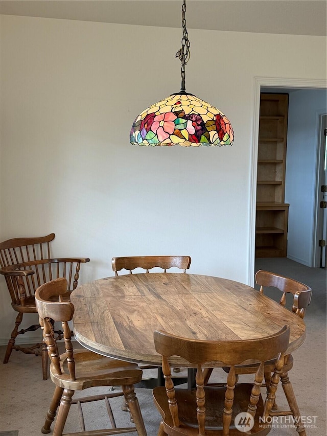 view of carpeted dining area