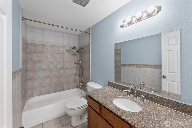 bathroom with vanity, visible vents, shower / washtub combination, tile patterned floors, and toilet