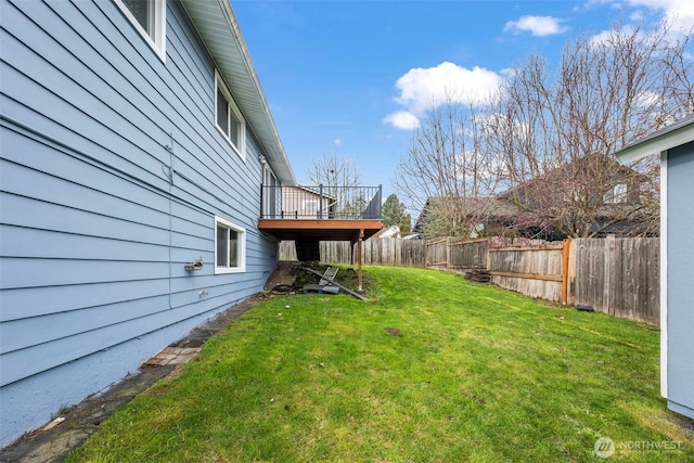 view of yard featuring fence and a wooden deck