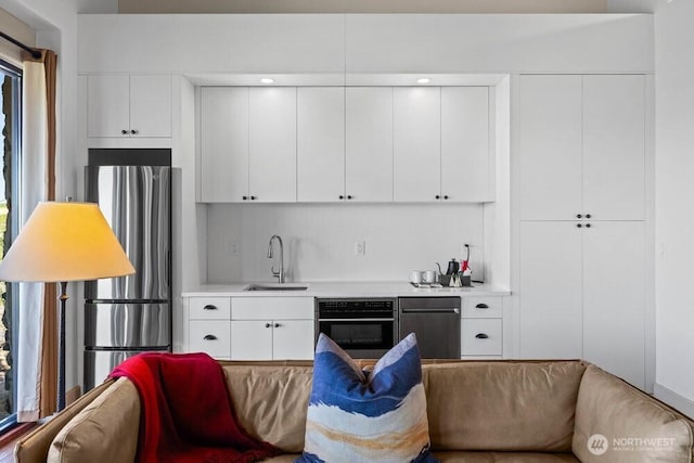 344 Silica Rd NW Unit 8, Quincy, WA 98848 - kitchen with stainless steel appliances, light countertops, and white cabinets