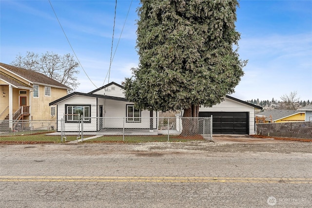 view of front of property featuring a fenced front yard and an outdoor structure