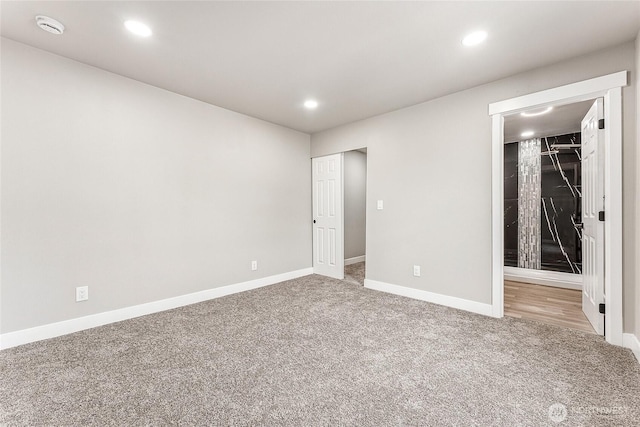 unfurnished bedroom featuring carpet, baseboards, and recessed lighting