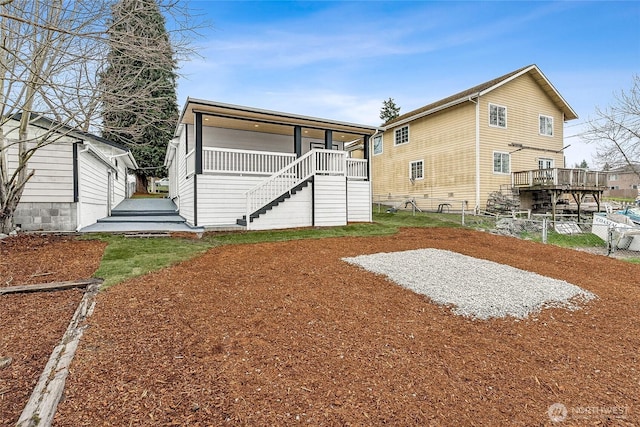 back of house with stairs and fence