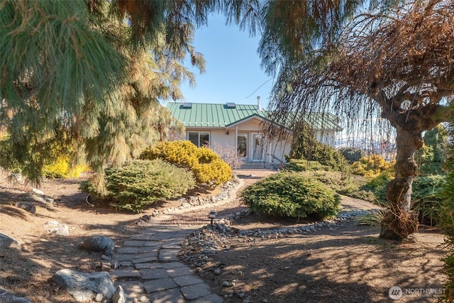 back of property with metal roof